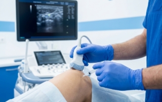 Physician performing PRP injection with ultrasound guidance on patient's knee in clinical setting