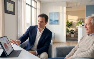 Medical professional consulting with patient about hyaluronic acid vs stem cells treatment options